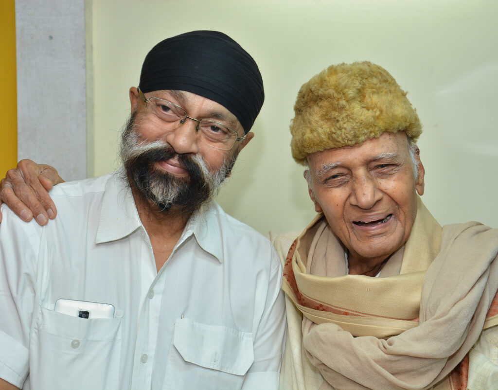 Shri Uttam Singh being showered with love by Shri Khayyamji